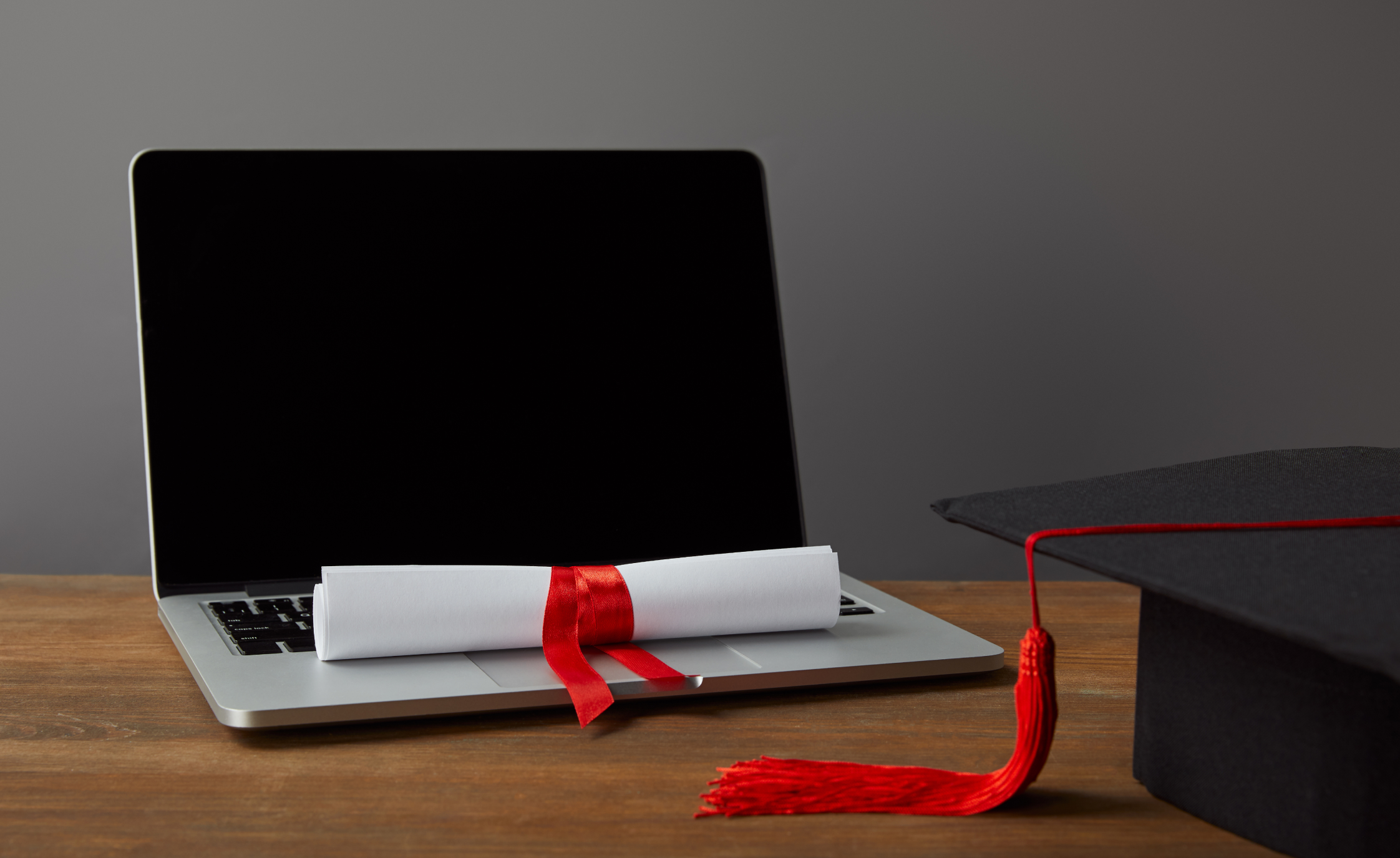 Laptop with graduation cap